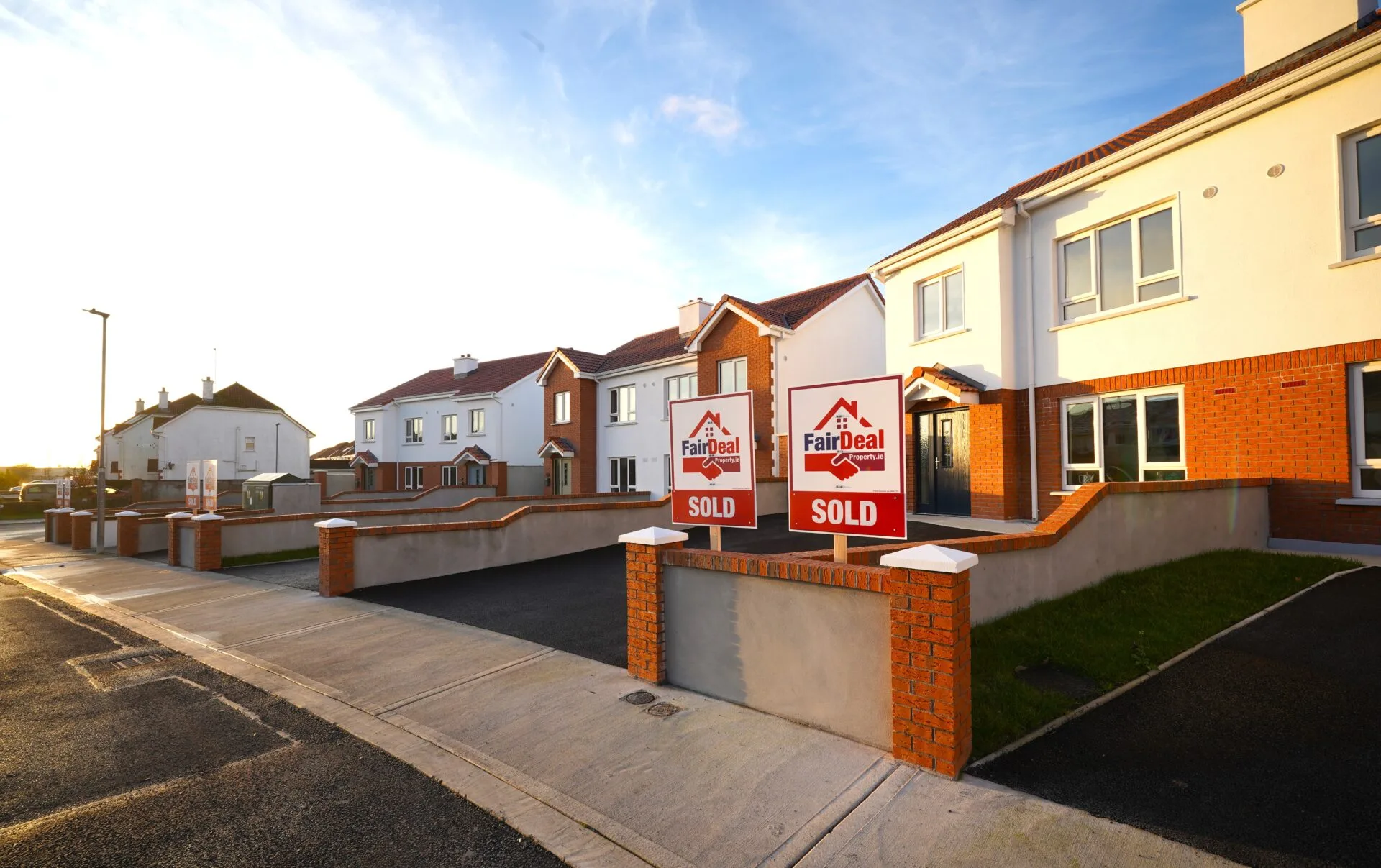 A series of new homes with Fair Deal Property property signage